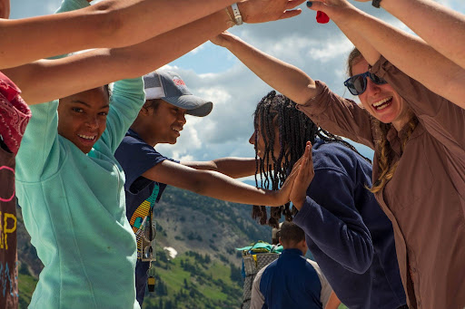 unnamed (1) Kids doing hand bridge and smiling